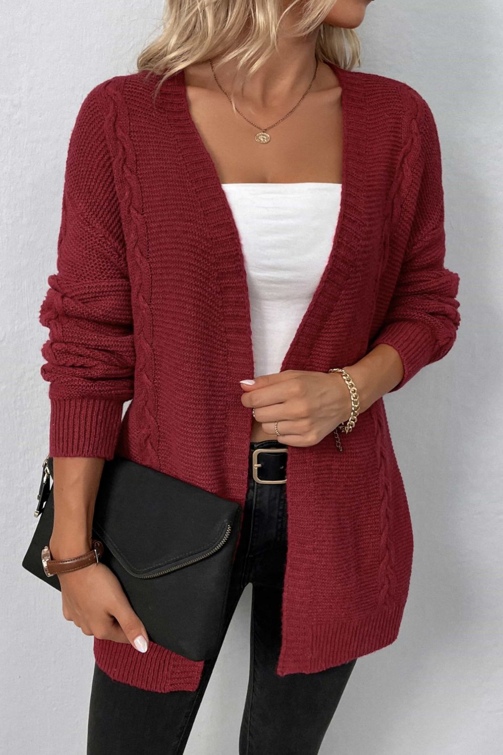 A Cable-Knit Open Front Cardigan with Pockets