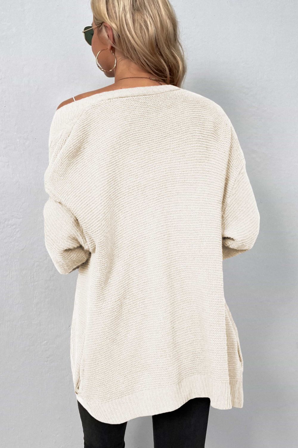 A Cable-Knit Open Front Cardigan with Pockets