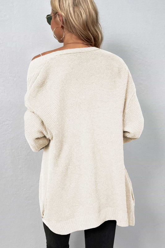 A Cable-Knit Open Front Cardigan with Pockets