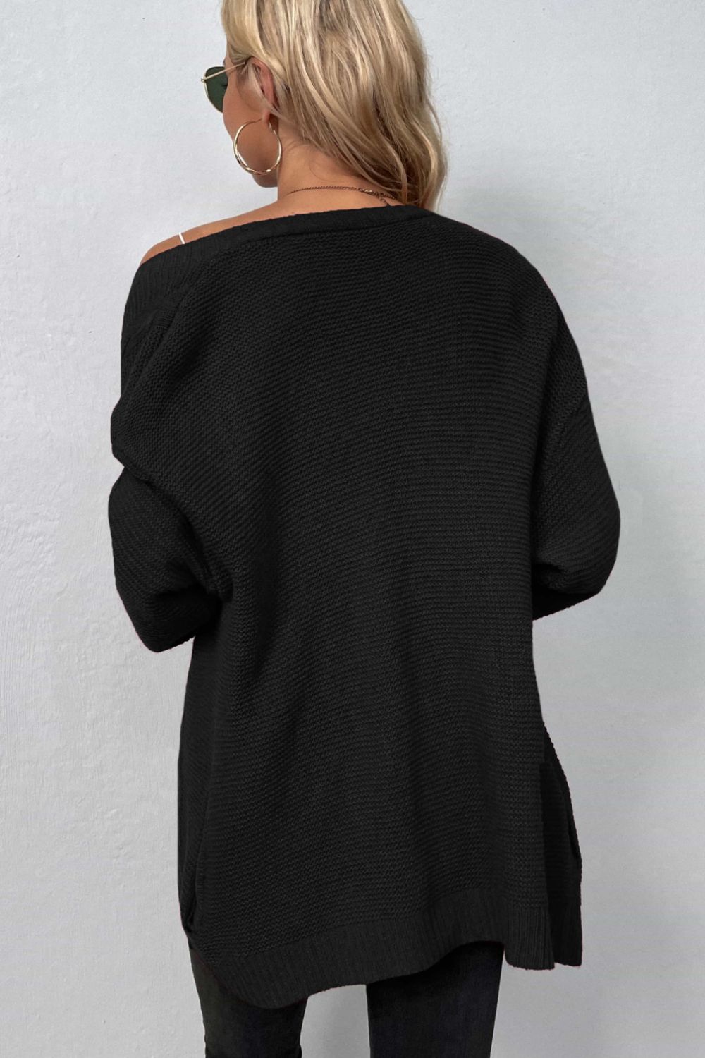 A Cable-Knit Open Front Cardigan with Pockets